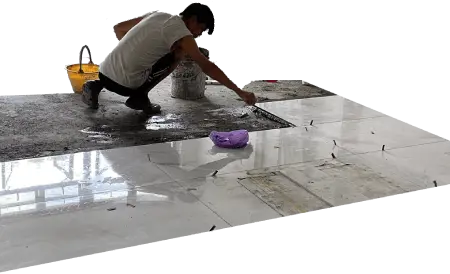 Tiling Singapore tiler laying floor tiles.